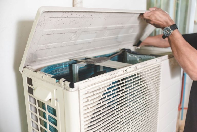 furnace and ac replacement cost hands doing ac maintenance